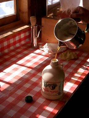 Pouring syrup in a jug.